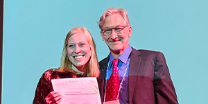 Corinna Schüß (Leipzig University) receiving her postdoc oral presentation award from Dr. Brad Taylor 