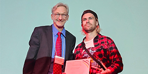 Brad Taylor presents Quentin Denis (Medical University Innsbruck) with his student poster award, which was sponsored by the Pittsburgh Center for Pain Research.