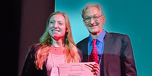 Lisa Peuker (Leipzig University) receives her student poster award from Dr. Brad Taylor (award sponsored by the University of Pittsburgh Department of Anesthesiology and Perioperative Medicine).